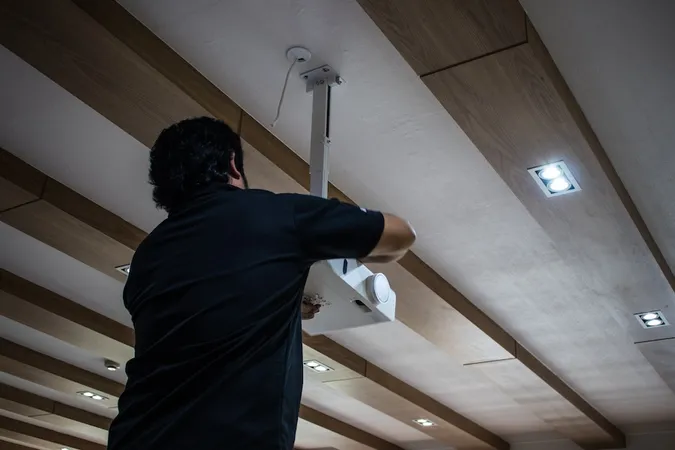 Technician Installing Projector